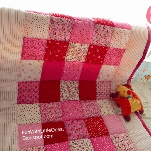 Pink Squares Patchwork Baby Quilt AllFreeSewingcom Quilt squares patchwork pink baby patterns easy beginners sew pretty allfreesewing
