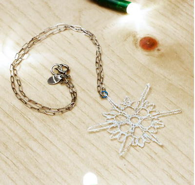 Delicate Crocheted Snowflake Pendant