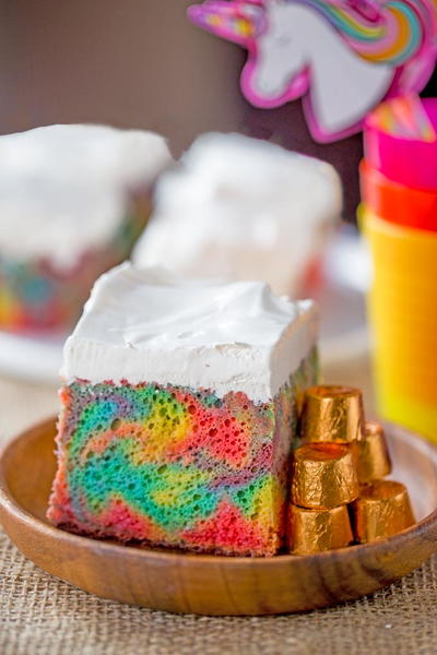 Rainbow Poke Cake with Whipped Cream Rainbow Poke Cake with Whipped Cream