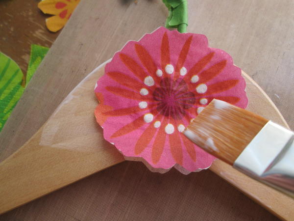 Gently brush additional medium over the flower to attach and smooth. 