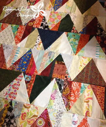 Image shows Jen's Scrappy Zigzag Triangle Quilt, up close. Image shows Jen's Scrappy Zigzag Triangle Quilt, up close.