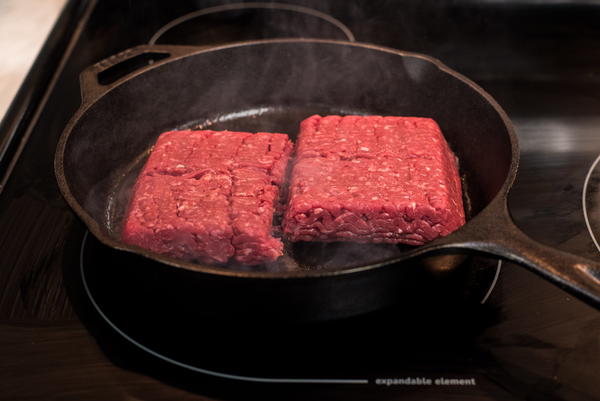 Add your ground beef to the center of the skillet.
