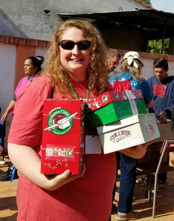 Betsy Burnett with shoebox gifts in Paraguay
