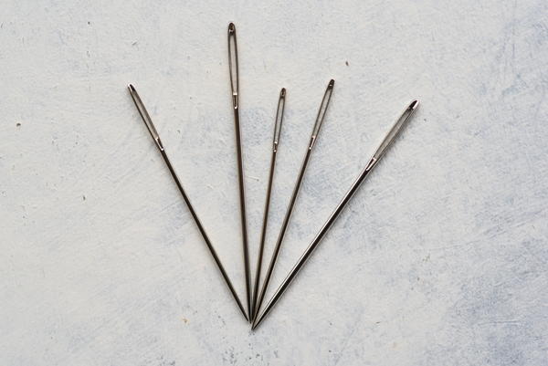Images shows five embroidery needles