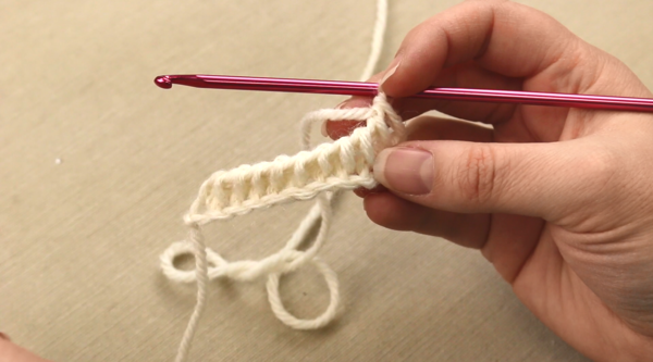 Image shows the third step in Tunisian crochet: the return pass.