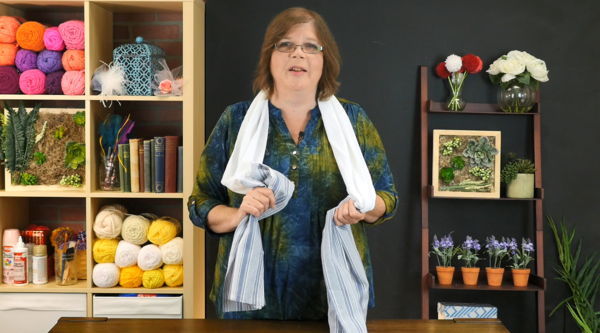 Image shows Mary Beth wearing the DIY Kitchen Towel Boa in the craft studio.