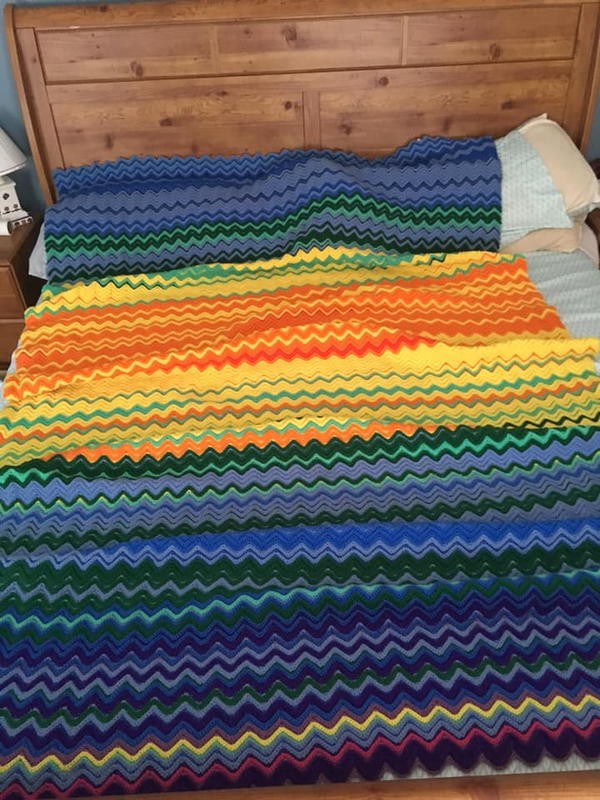 Image shows a crochet temperature blanket pattern.