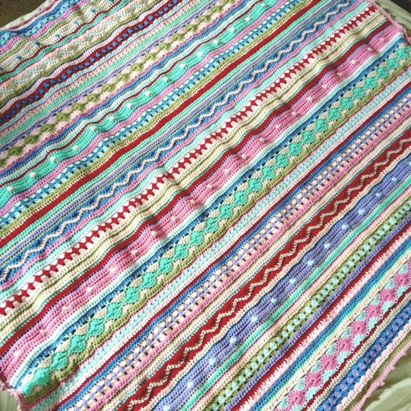 Image shows the As-We-Go Stripey Blanket from Not Your Average Crochet. Image shows the As-We-Go Stripey Blanket from Not Your Average Crochet.