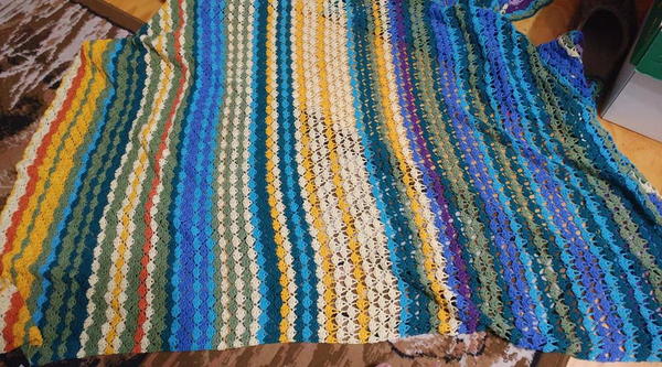 Image shows the Shell Stitch Temperature Blanket.