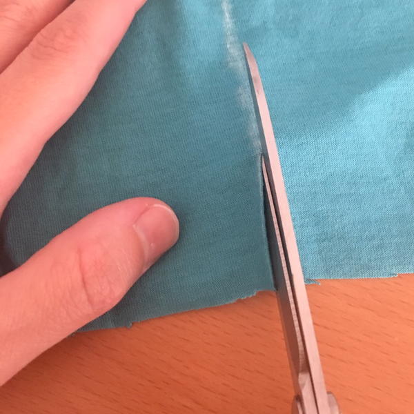 Example showing correct way of cutting fabric.
