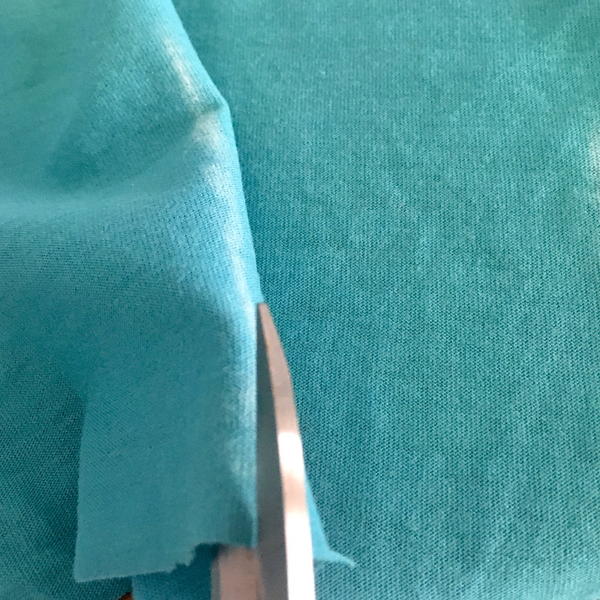 Example showing incorrect way of cutting fabric.