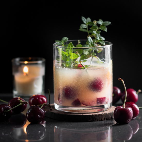 Orange Whisky Sour Cocktail with Cherries Orange Whisky Sour Cocktail with Cherries