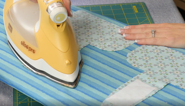 Image shows interface being ironed onto the two fabric top towel pieces.