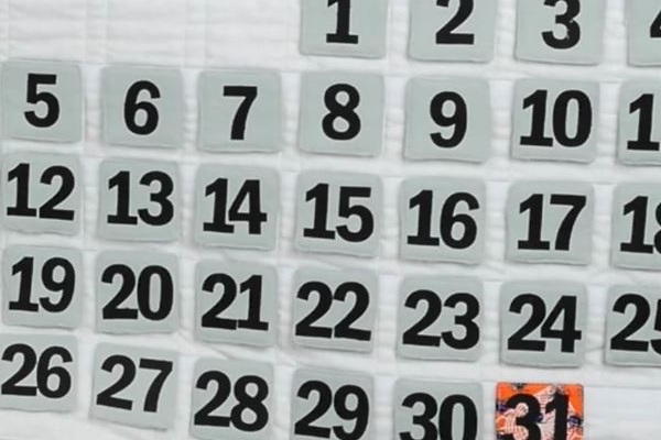 Image shows a close up of the finished quilted wall calendar.