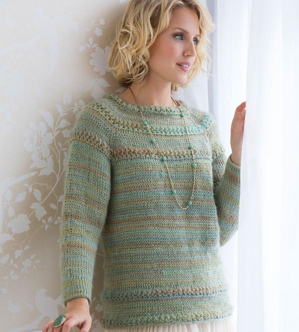 image shows the Tunisian Stitch Crochet Sweater on a model.