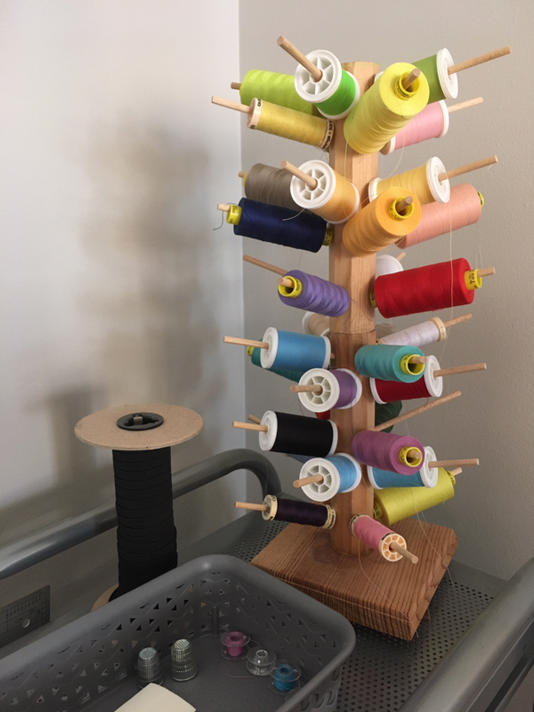 Image shows a thread tree and box of bobbins.