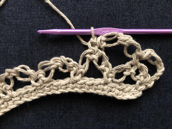 Image shows step 3 for a new row for crocheting the Solomon's Knot stitch.