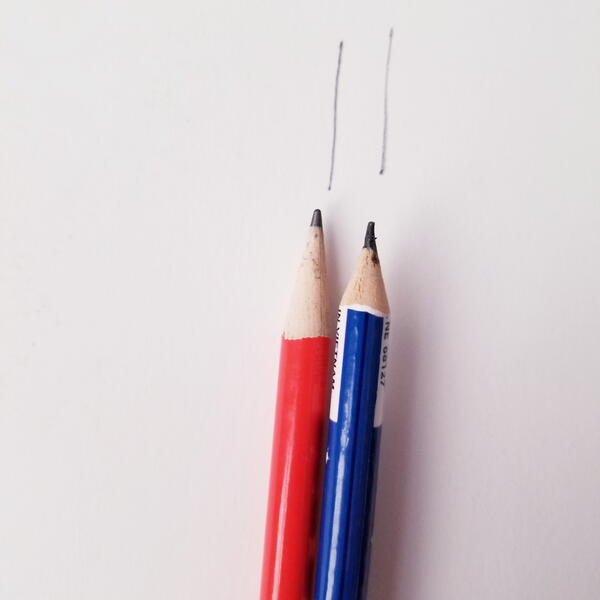 Two pencils marked seam allowance