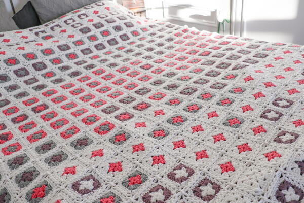 Image shows the Adding Up Memories Temperature Blanket from Rachel Hill from Ravin Sekai Designs.