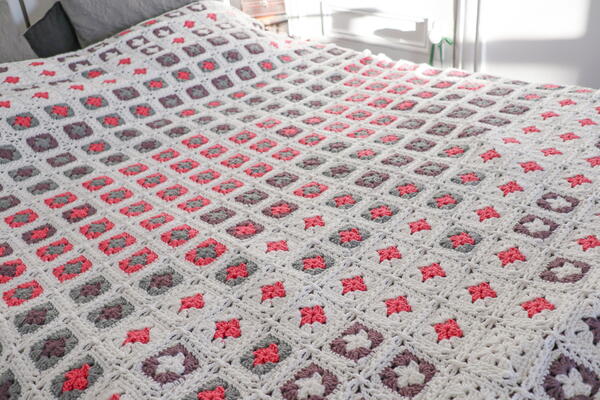 Image shows the Adding Up Memories Temperature Blanket from Rachel Hill from Ravin Sekai Designs. Image shows the Adding Up Memories Temperature Blanket from Rachel Hill from Ravin Sekai Designs.
