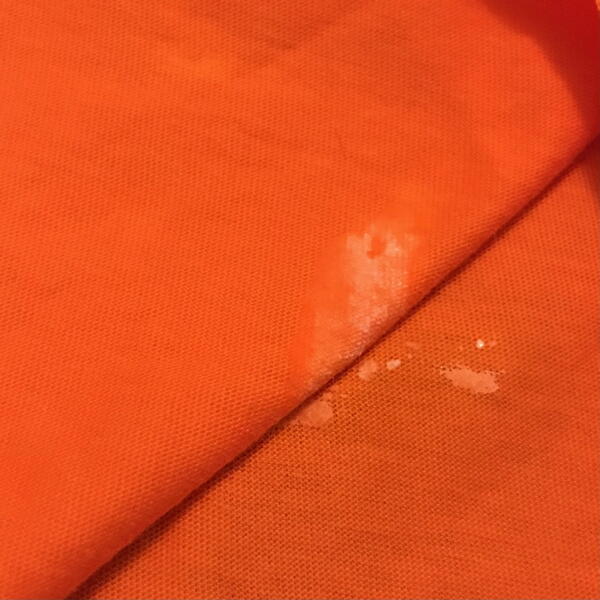 Image shows craft glue transferring on the fabric.