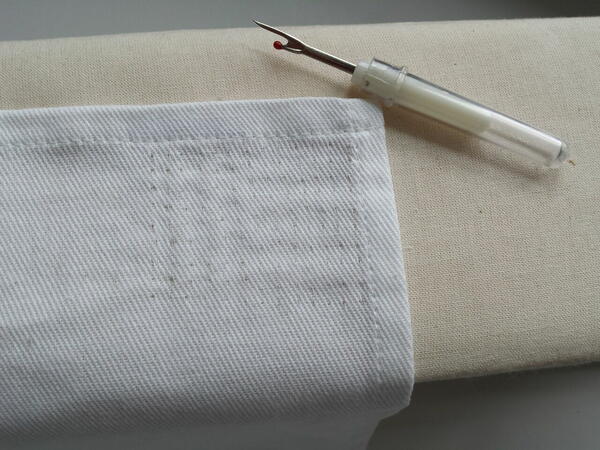 Image shows fabric with the stitches removed (via seam ripper).