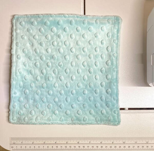 Preemie Cuddle Blanket for Charity being measured