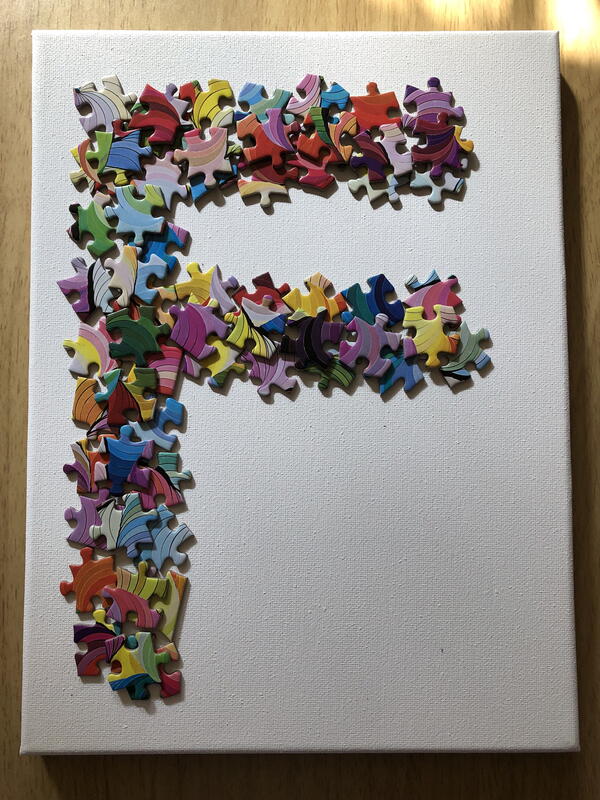Lay out the puzzle pieces on your canvas