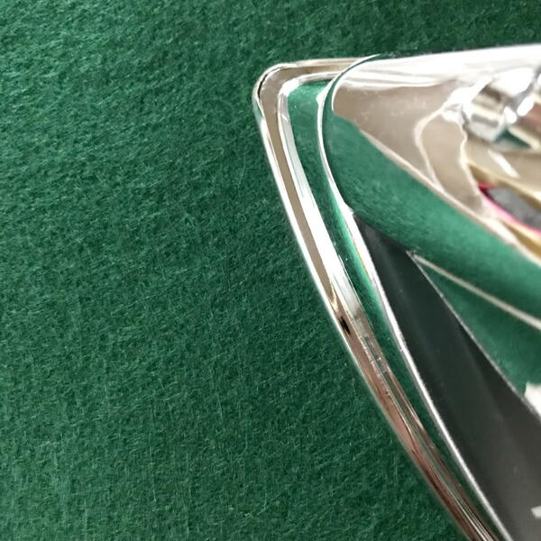 Ironing a green felt sheet
