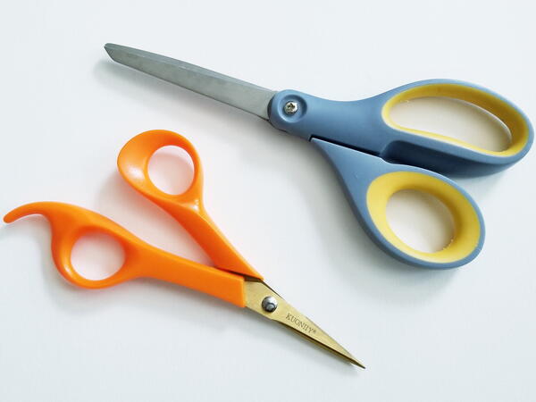 Image shows two pairs of sewing scissors.