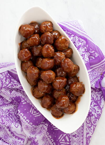 Saucy Slow Cooker Meatballs With Grape Jelly And Chili Sauce
