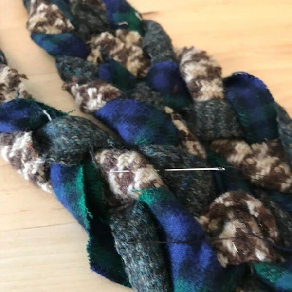 Sewing fabric braids together