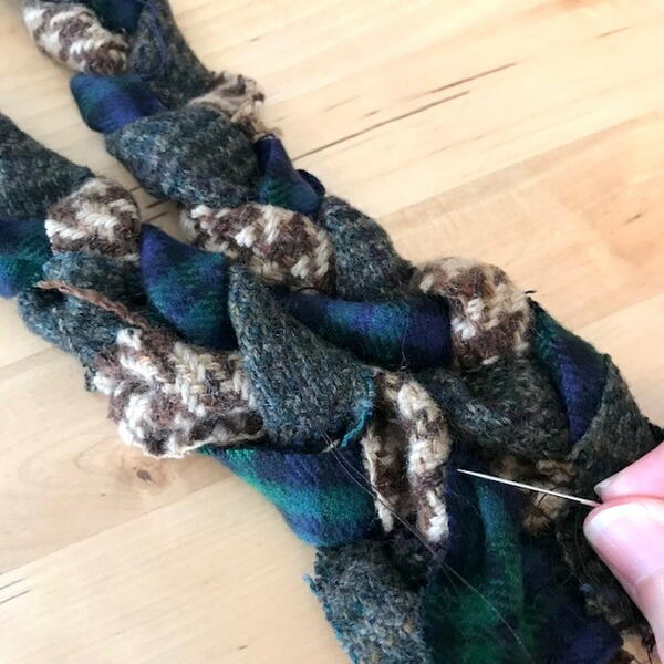 Sewing fabric braids together
