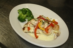 Seared Tasman Sea Barramundi with Sauteed Shrimp, Red and Yellow Peppers and Jalapeno Citrus Vinaigrette