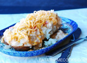 Slow Cooker King Ranch Chicken Over Baked Potatoes