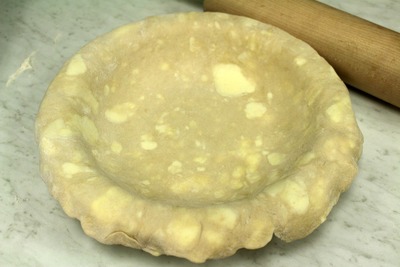 Drap the dough over the pie dish