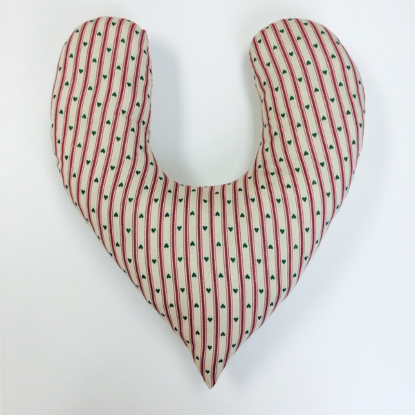 Image shows a finished DIY mastectomy pillow in a striped fabric.