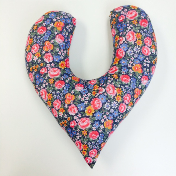 Image shows a finished DIY mastectomy pillow in a floral fabric.