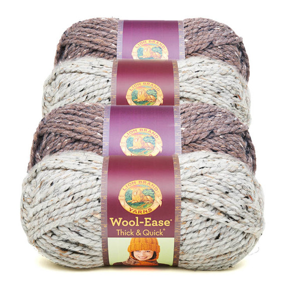 Image shows four skeins in a row of Lion Brand's popular wool yarn, Wool-Ease, two in variegated beige and two in variegated brown.