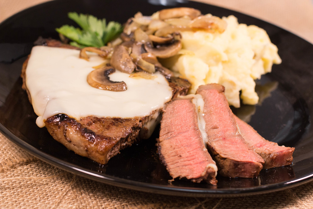 Applebee's Cook Copycat Applebee's Smothered Steak Skillet | AllFreeCopycatRecipes.com