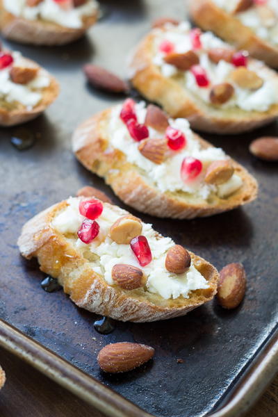 Smokehouse Almond, Goat Cheese, and Pomegranate Toasts