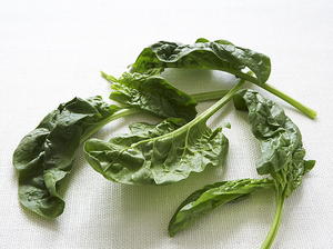 Grilled Sweetbreads over Wilted Spinach with Sweet-and-Sour Bacon Dressing