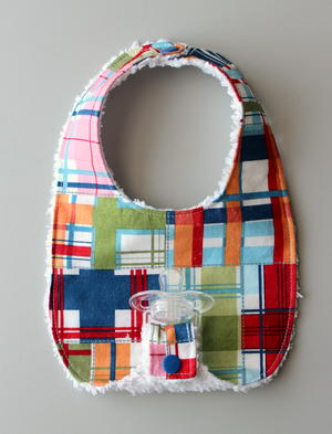 bib with pacifier holder