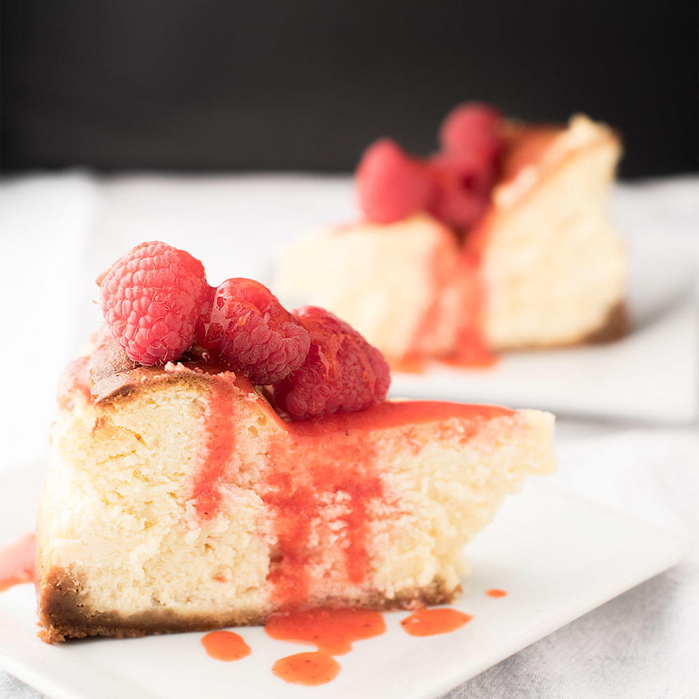 Lemon Cheesecake with Berry Drizzle | TheBestDessertRecipes.com