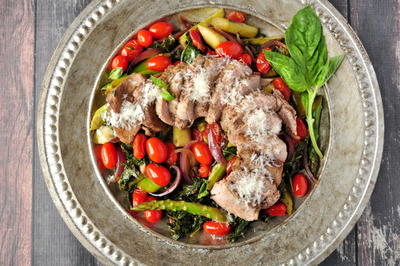 Pork over Warm Kale and Asparagus Salad