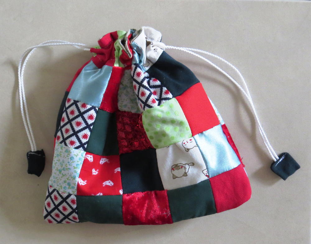 Christmas gift quilts Scrappy Patchwork Gift Bag | AllFreeSewing.com