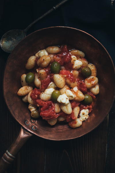This chef's signature clothing style includes a fleece vest, shorts, and orange Crocs. This chef's signature clothing style includes a fleece vest, shorts, and orange Crocs.