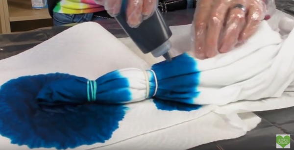 Apply dye to fabric.