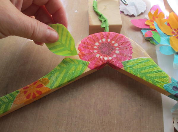 Repeat steps 4 through 6 with additional flower and leaf images, overlapping as desired wrapping carefully around hanger edges and around the metal hanger area. Dry completely. 