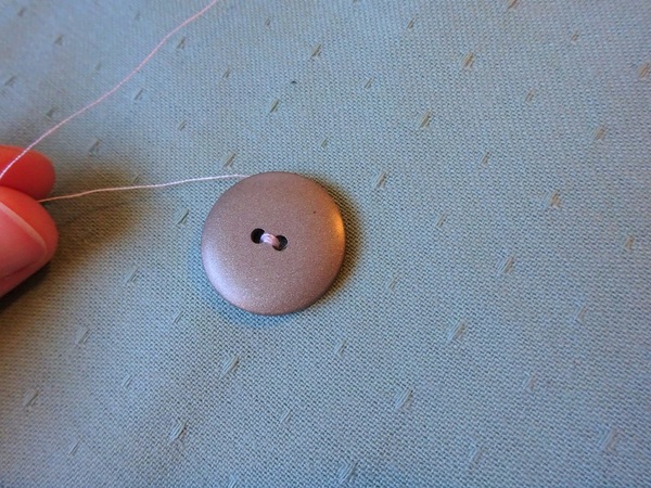 How to Sew a Two Hole Button | AllFreeSewing.com